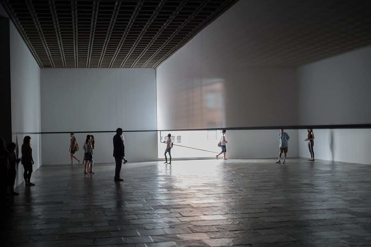 Robert Irwin, Scrim Veil—Black Rectangle—Natural Light, installed at the Whitney — the artist shown by the work, not a portrait